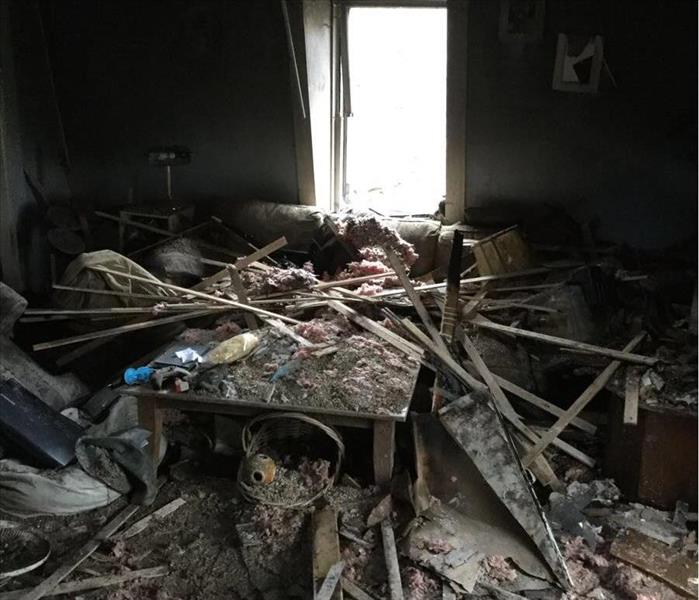 Interior badly damaged by fire, filled with debris