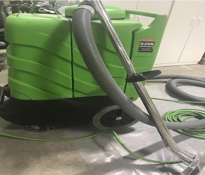 SERVPRO branded green heavy duty carpet extractors