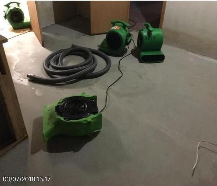 SERVPRO drying equipment in basement